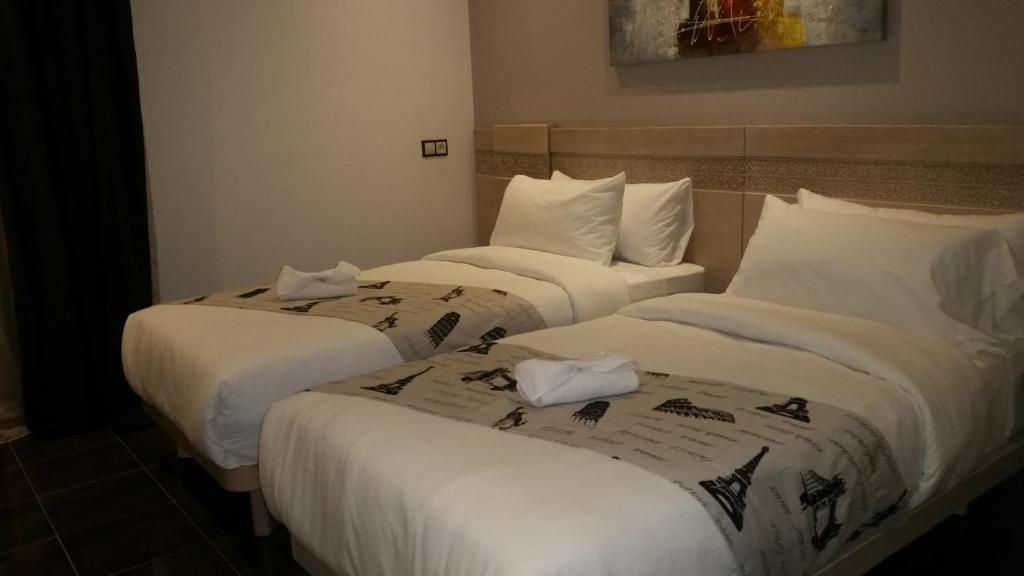 Voodi või voodid majutusasutuse Hotel A44 toas