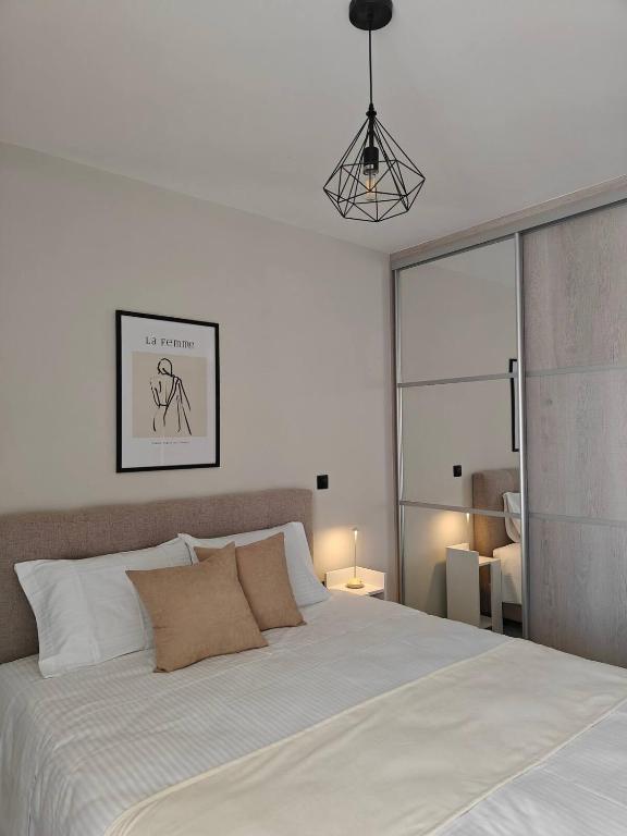Postel nebo postele na pokoji v ubytování Orchidea Flat