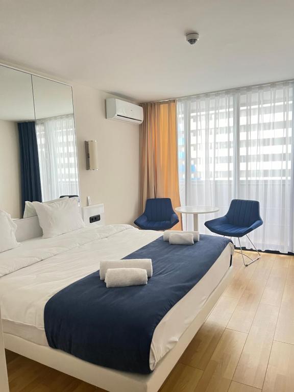 Ένα ή περισσότερα κρεβάτια σε δωμάτιο στο Orbi city Sea view 5star