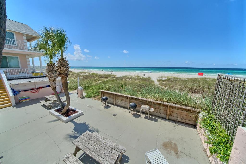 a view of the beach from the balcony of a house at Pineapple Villas in Panama City Beach