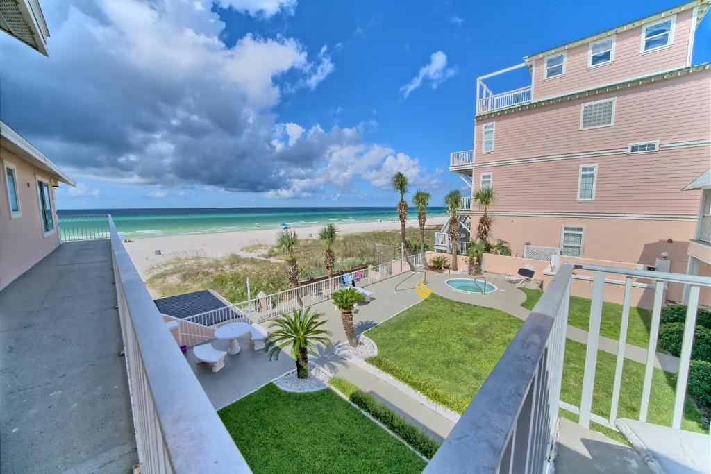 a view of the beach from the balcony of a condo at Pineapple Villas in Panama City Beach