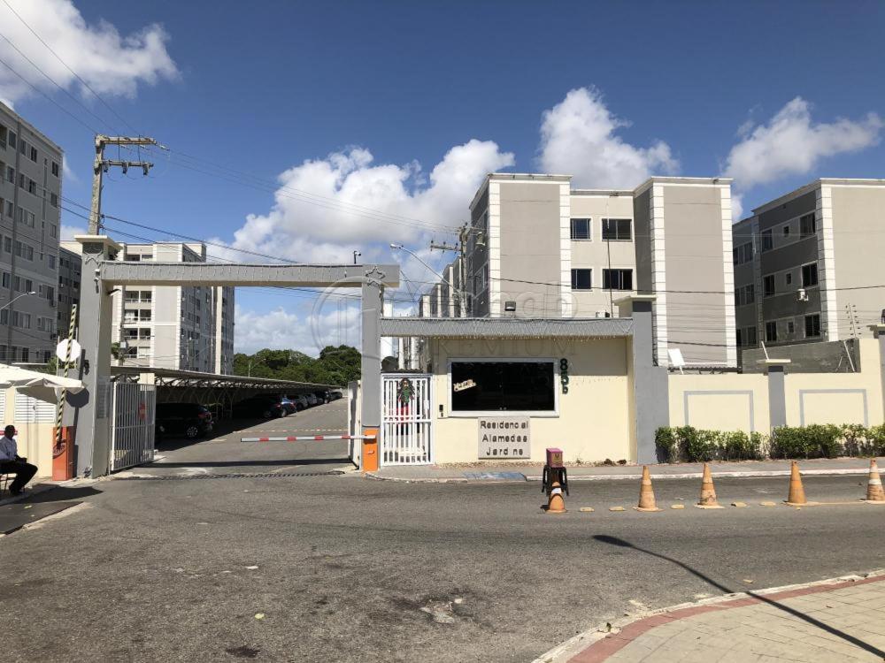 an empty street with a building with a gate at RESIDENCIAL ALAMEDA JARDINS in Aracaju