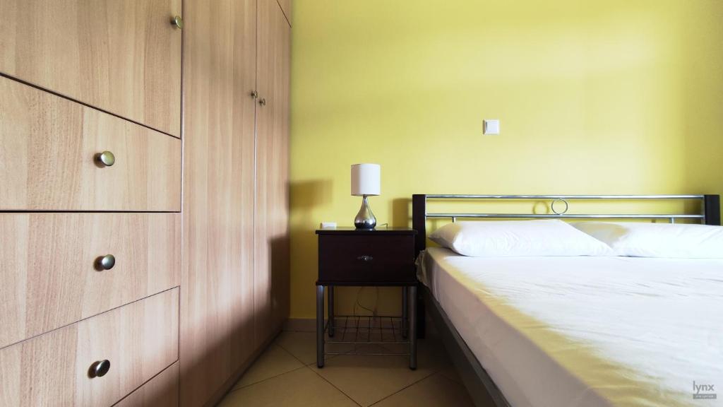 Postel nebo postele na pokoji v ubytování Orion Suite & Apartments