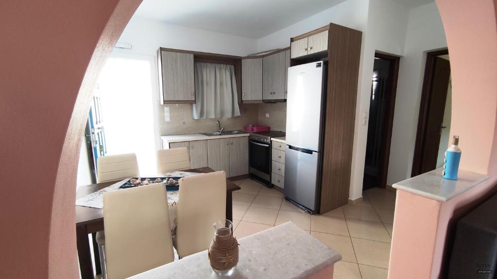 Kuchyň nebo kuchyňský kout v ubytování Orion Suite & Apartments