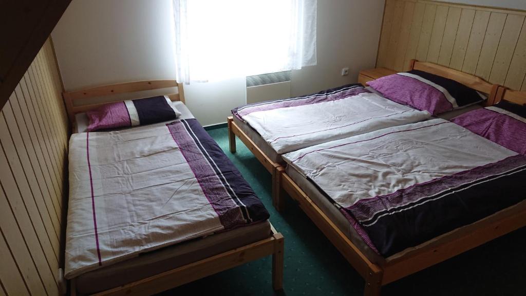 Postel nebo postele na pokoji v ubytování Chatka č. 6