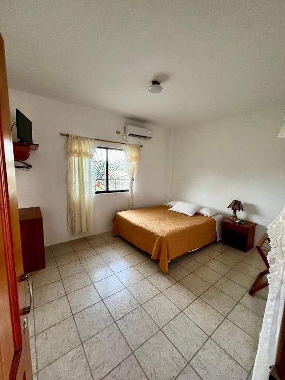 Postel nebo postele na pokoji v ubytování Casa de Nelly
