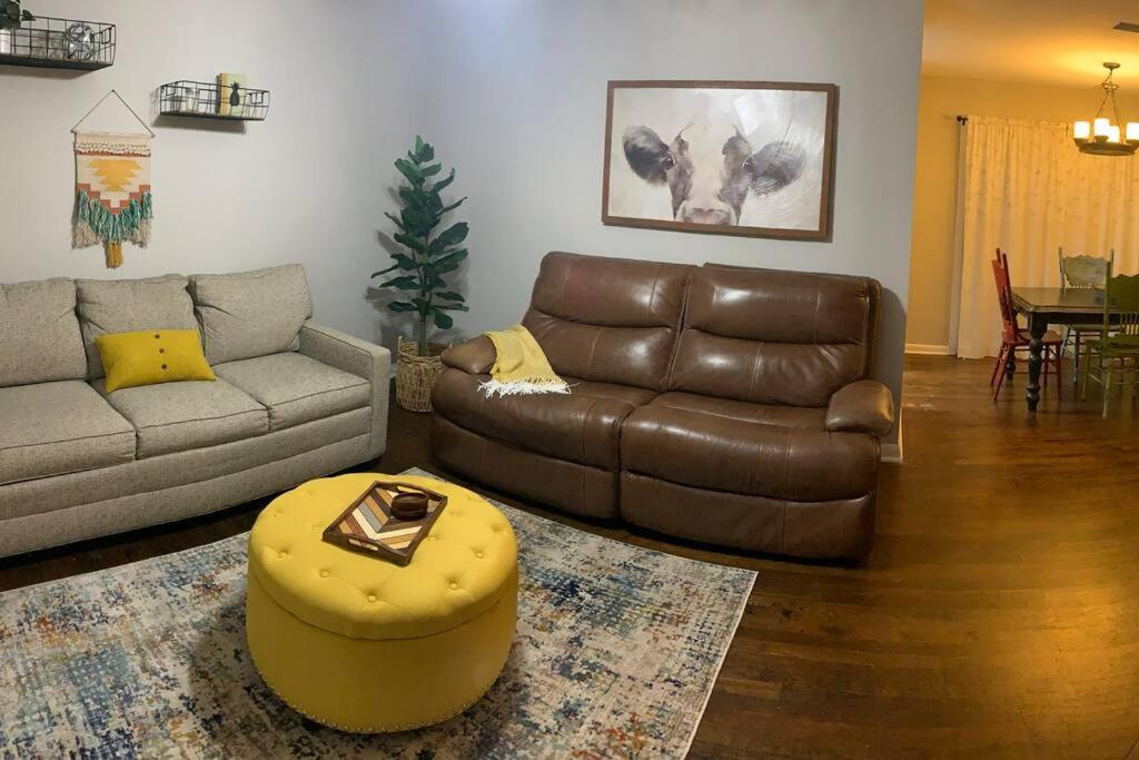 a living room with a couch and a table at *3 blocks from AT&T Stadium* 2 bedroom-sleeps 6 in Arlington