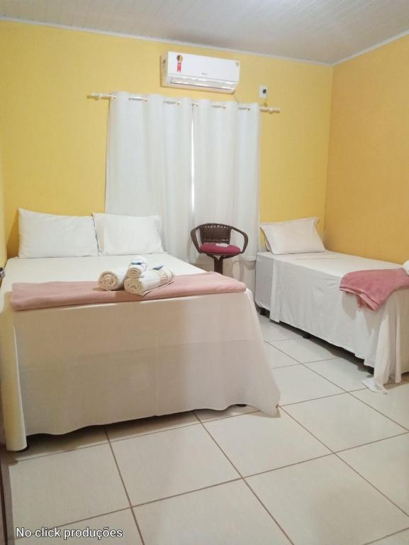 Uma cama ou camas num quarto em Pousada Voadores Jalapão