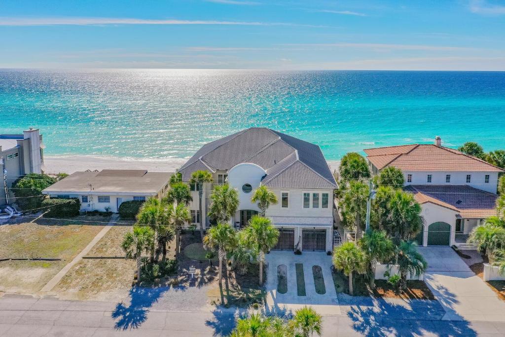 an aerial view of a house with the ocean in the background at 408 Blue Mountain in Santa Rosa Beach