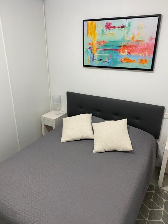 Postel nebo postele na pokoji v ubytování COEUR DE CALVI