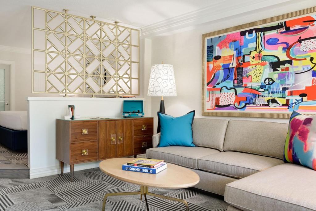 a living room with a couch and a table at Le Parc at Melrose in Los Angeles