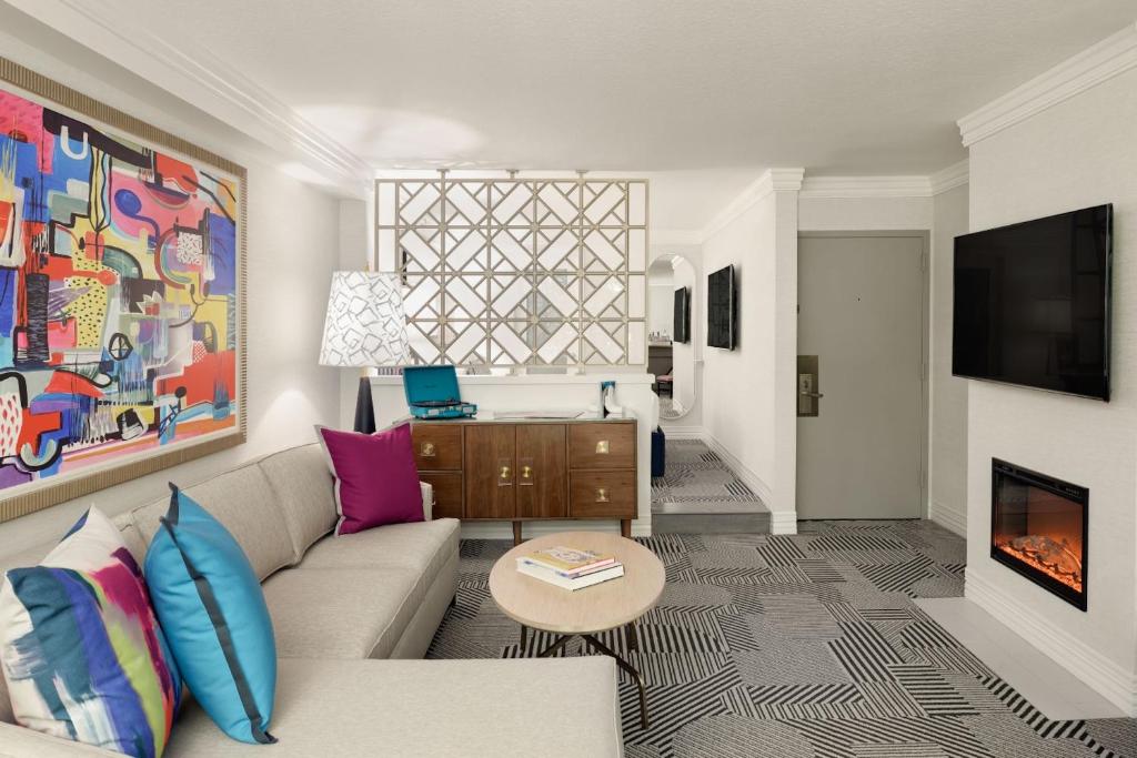 a living room with a couch and a table at Le Parc at Melrose in Los Angeles