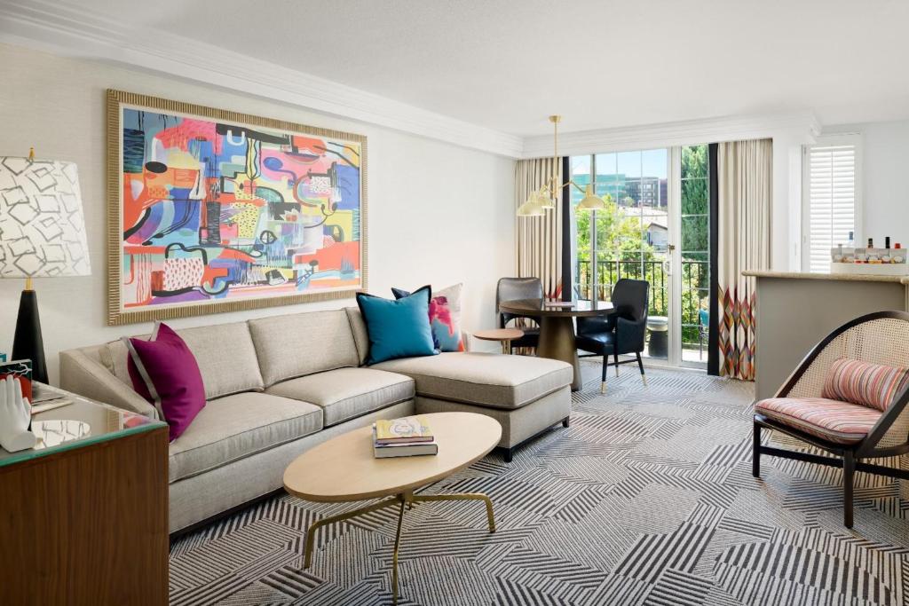 a living room with a couch and a table at Le Parc at Melrose in Los Angeles