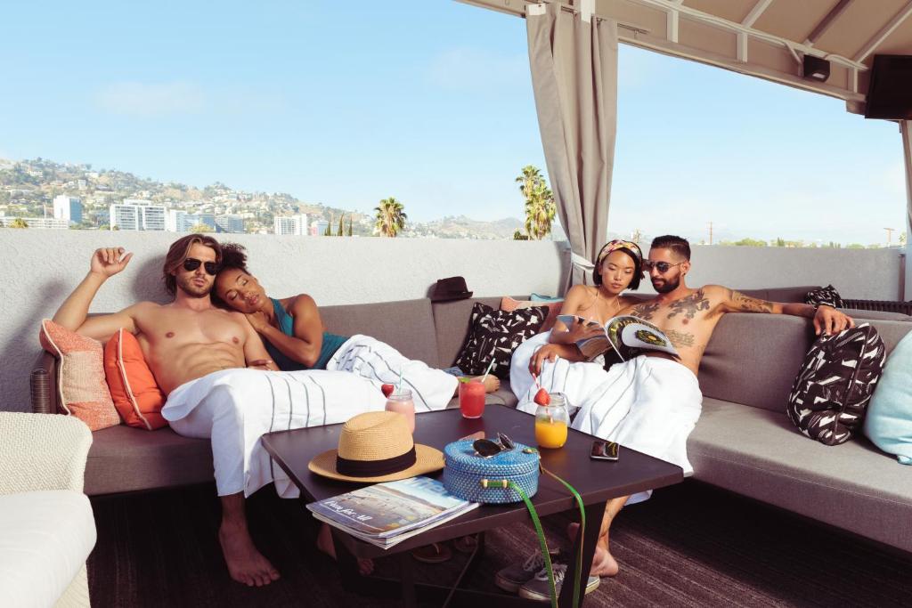 a group of people sitting on a couch at Le Parc at Melrose in Los Angeles
