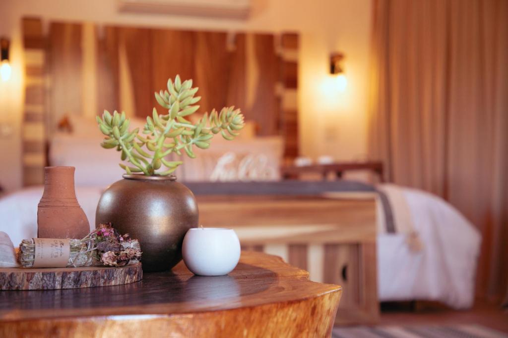 Postel nebo postele na pokoji v ubytování Indomito Resort & Hotel Boutique