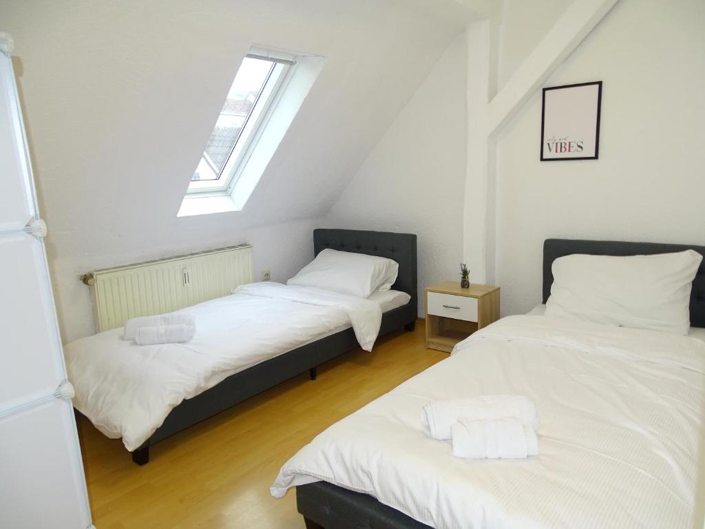 Cama ou camas em um quarto em Zentrale Stadtwohnung bis zu 9 Personen in Kirchheim unter Teck