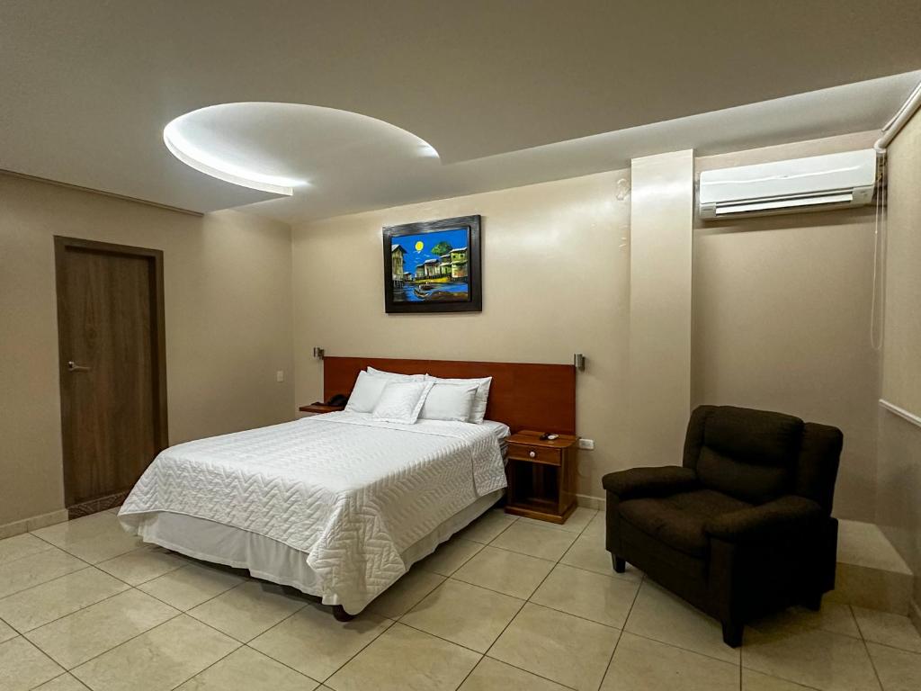 Postel nebo postele na pokoji v ubytování Hotel Bucaneiro