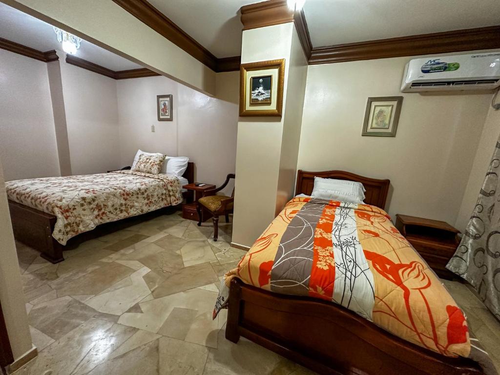 Postel nebo postele na pokoji v ubytování Hotel Bucaneiro