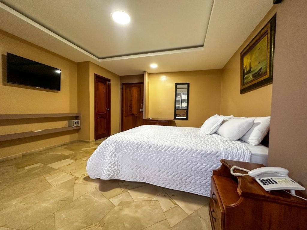 Postel nebo postele na pokoji v ubytování Hotel Bucaneiro