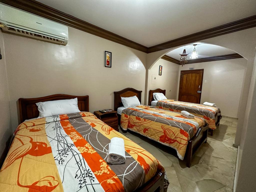 Postel nebo postele na pokoji v ubytování Hotel Bucaneiro