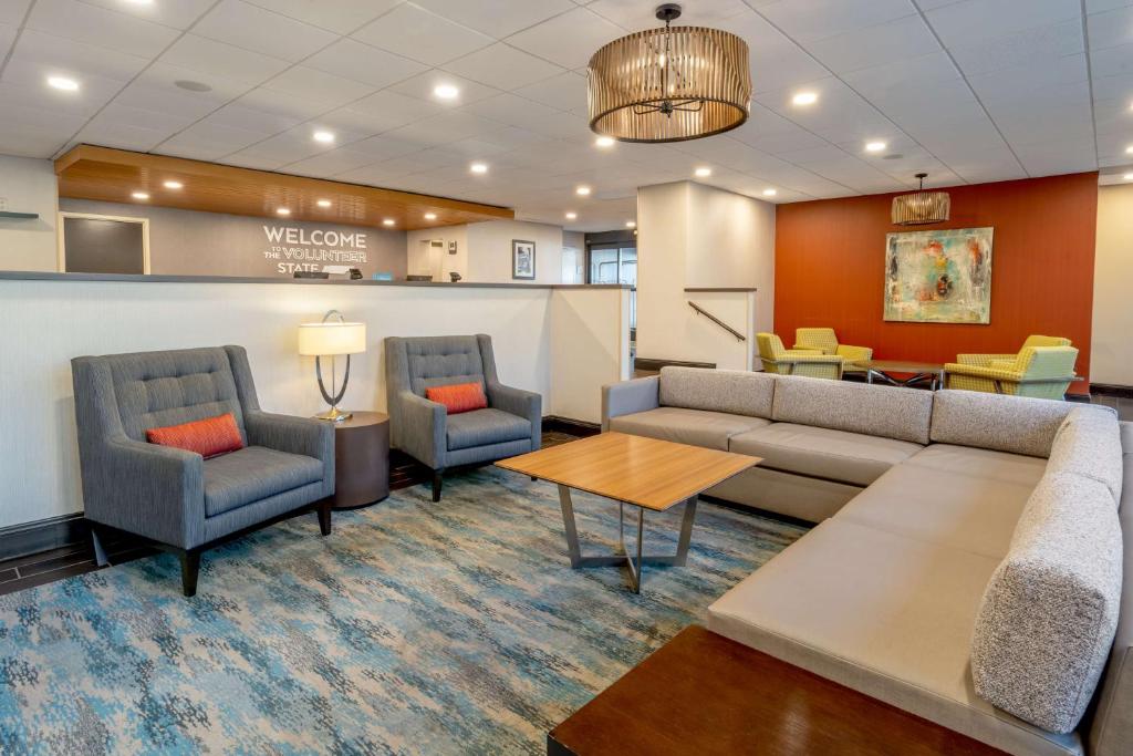 a waiting room with a couch and chairs and a table at Hampton Inn Nashville / Vanderbilt in Nashville
