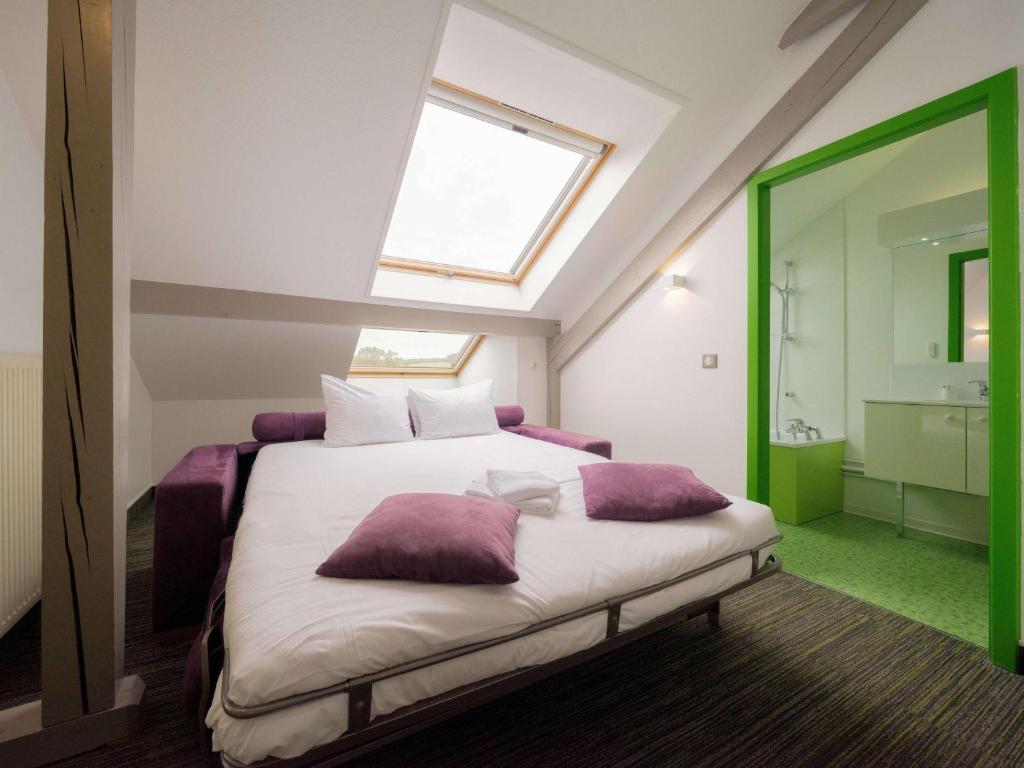 Postel nebo postele na pokoji v ubytování ibis Styles Sarrebourg
