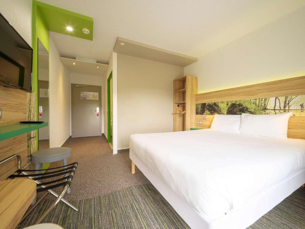 Postel nebo postele na pokoji v ubytování ibis Styles Sarrebourg