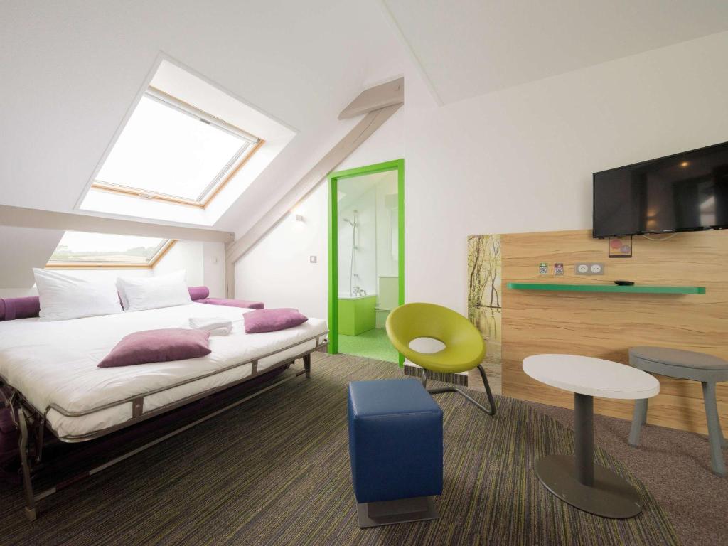 Postel nebo postele na pokoji v ubytování ibis Styles Sarrebourg