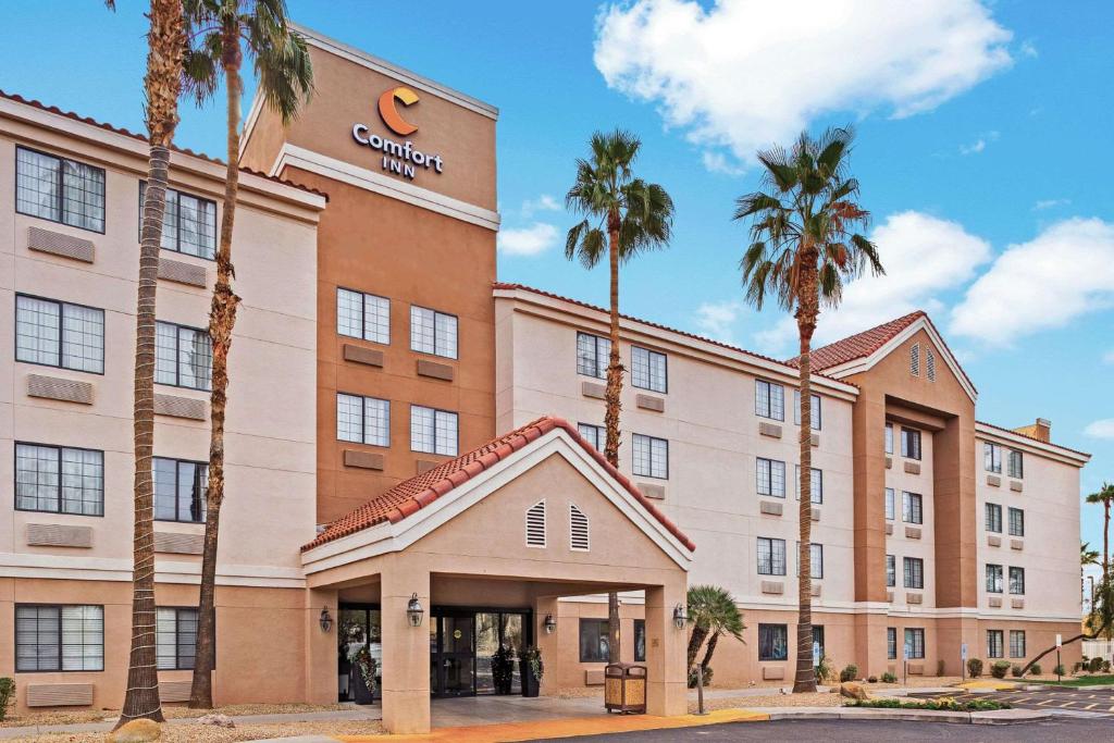 a rendering of the exterior of a hotel with palm trees at Comfort Inn Chandler - Phoenix South I-10 in Chandler
