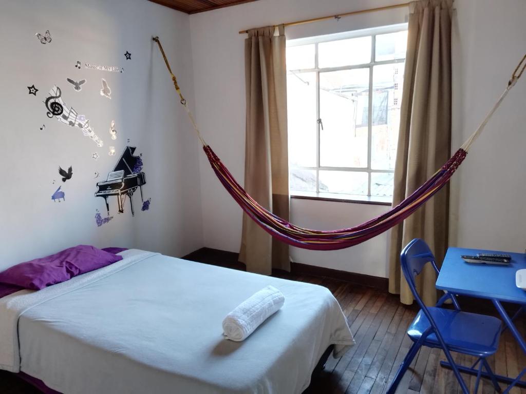 Postel nebo postele na pokoji v ubytování Casa en Bogotá ubicada en zona central