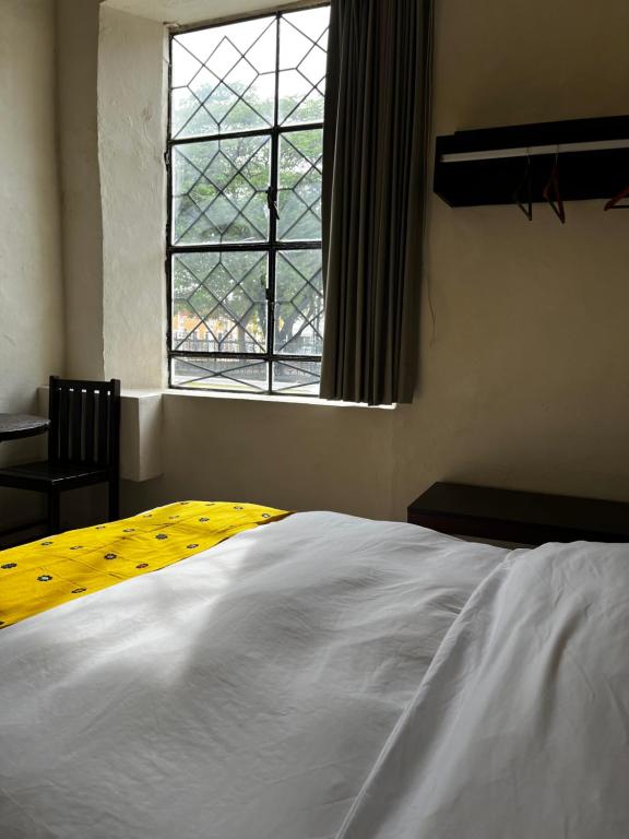 Postel nebo postele na pokoji v ubytování Hotel Maculís