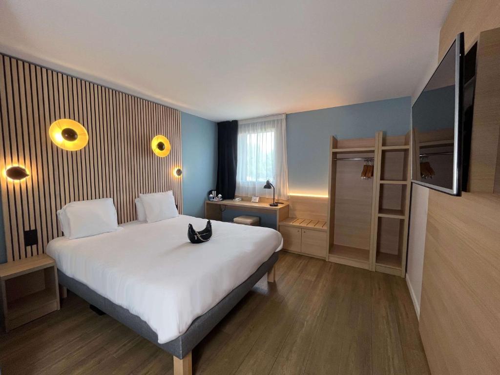Postel nebo postele na pokoji v ubytování Best Western Bourgoin Jallieu