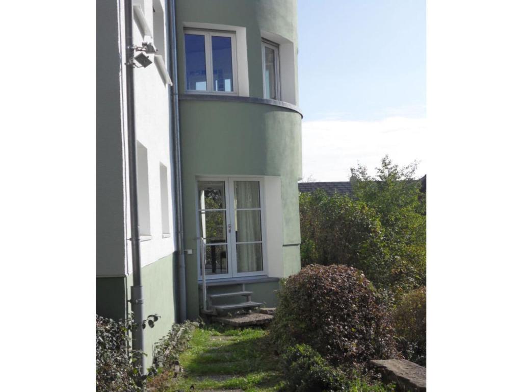 a white house with a window on the side of it at Epple in Tübingen am Neckar in Tübingen