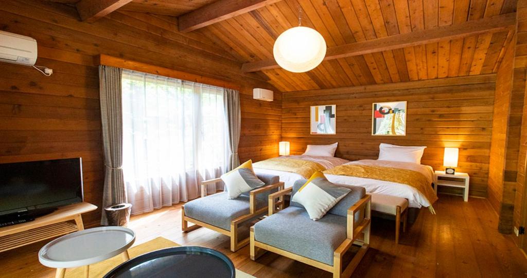 Postel nebo postele na pokoji v ubytování Resol no Mori