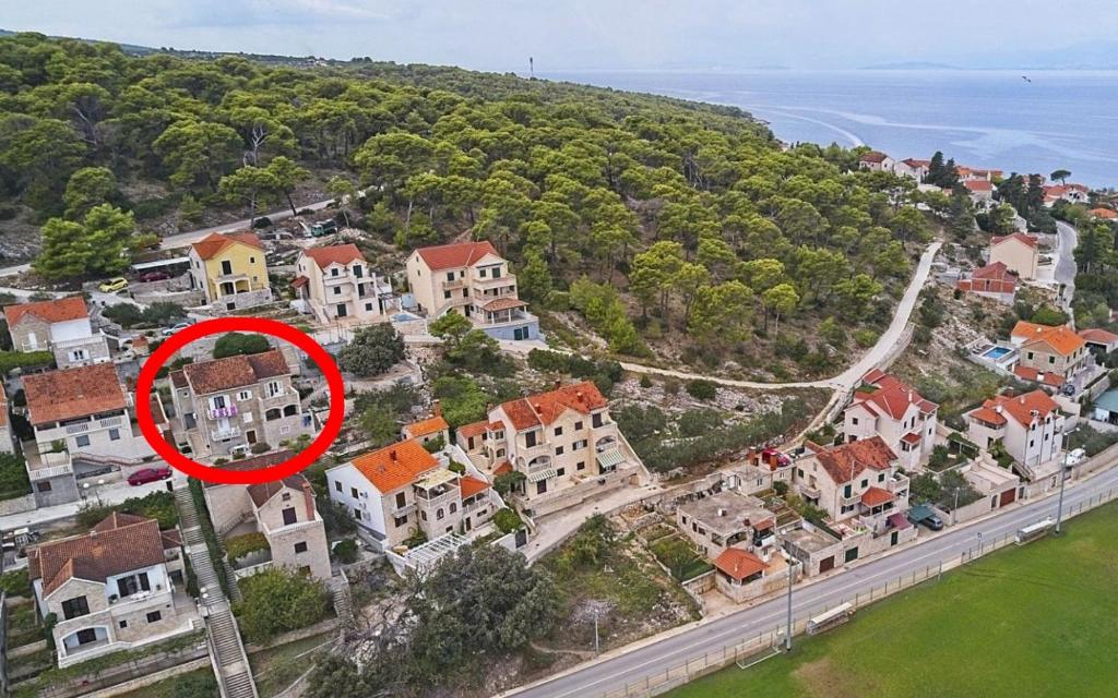 an aerial view of a city with a red circle at Apartments with a parking space Postira, Brac - 22150 in Postira