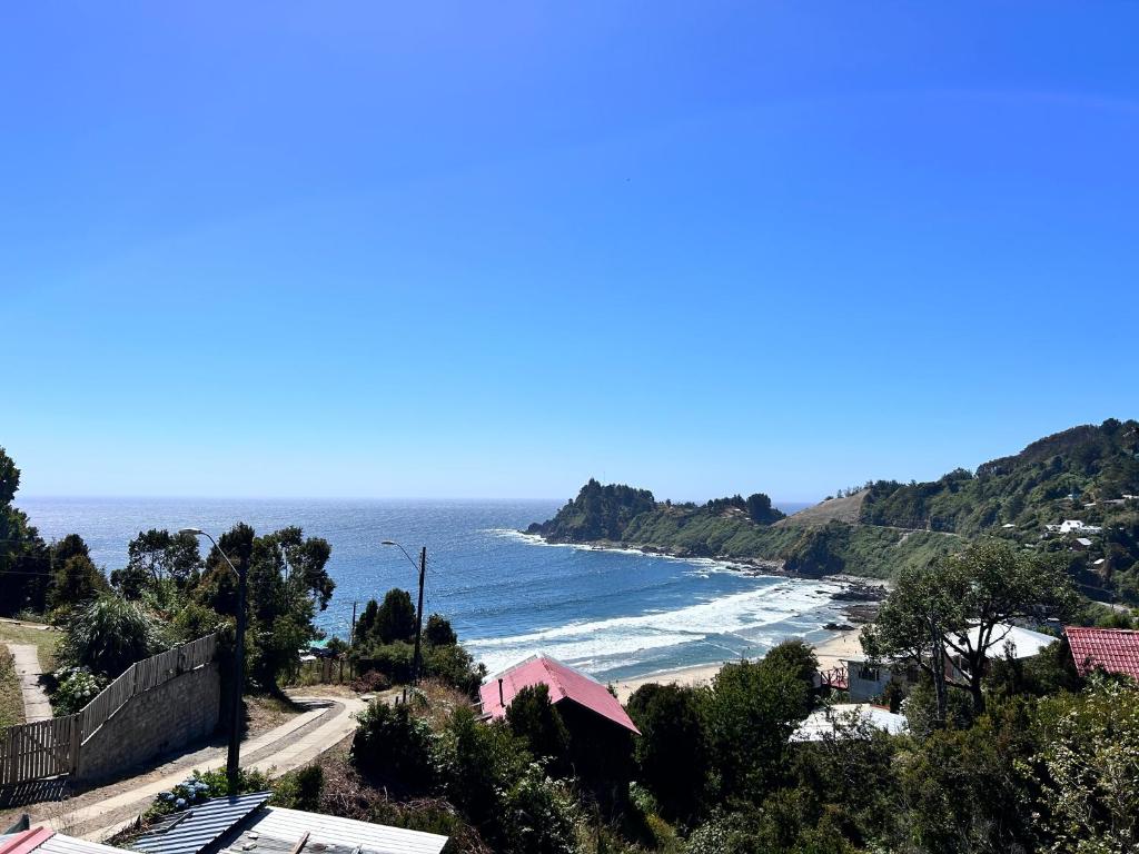 a view of a beach with the ocean at Cabañas Emma Maicolpue in Osorno