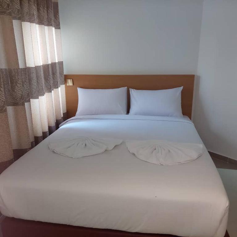 Postel nebo postele na pokoji v ubytování One Dream Hotel