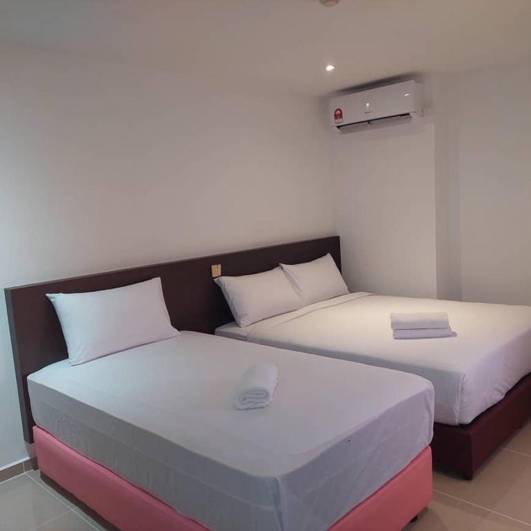 Postel nebo postele na pokoji v ubytování One Dream Hotel