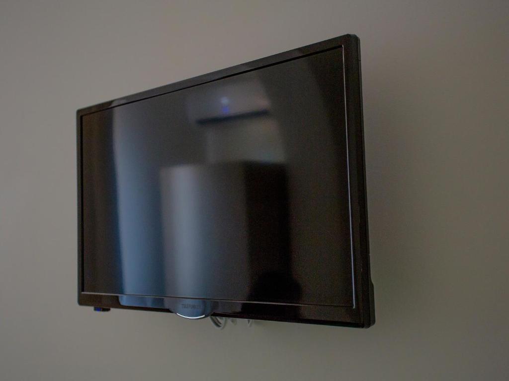 TV a/nebo společenská místnost v ubytování Casa dei Carrubi
