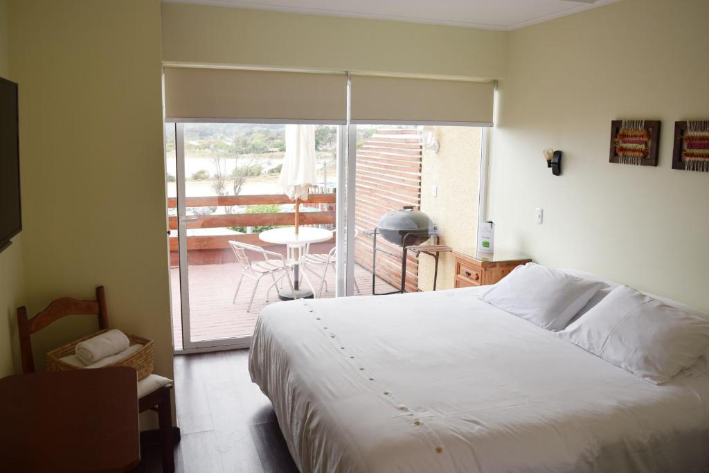 Postel nebo postele na pokoji v ubytování Riomar Apart Hotel