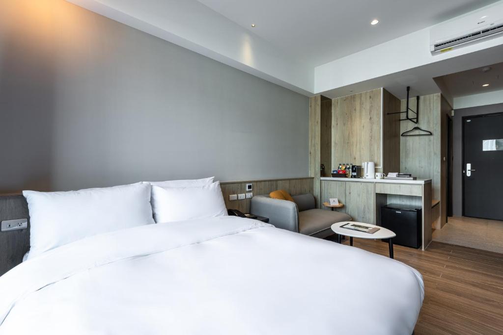 Postel nebo postele na pokoji v ubytování Hotel Euphemia