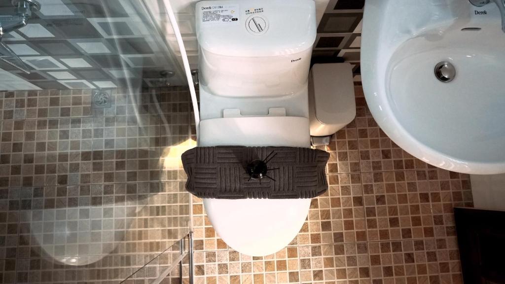 Koupelna v ubytování 咻咻宿 Xiuxiu 電梯宅