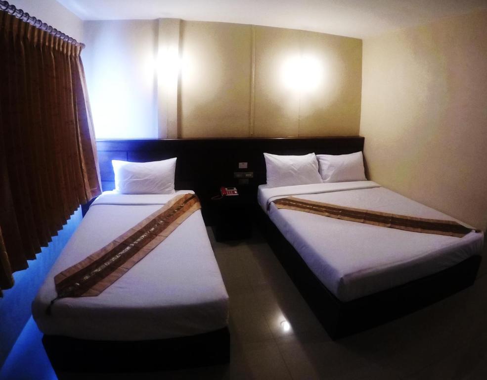 Postel nebo postele na pokoji v ubytování Chiangkhong Green Inn Resident
