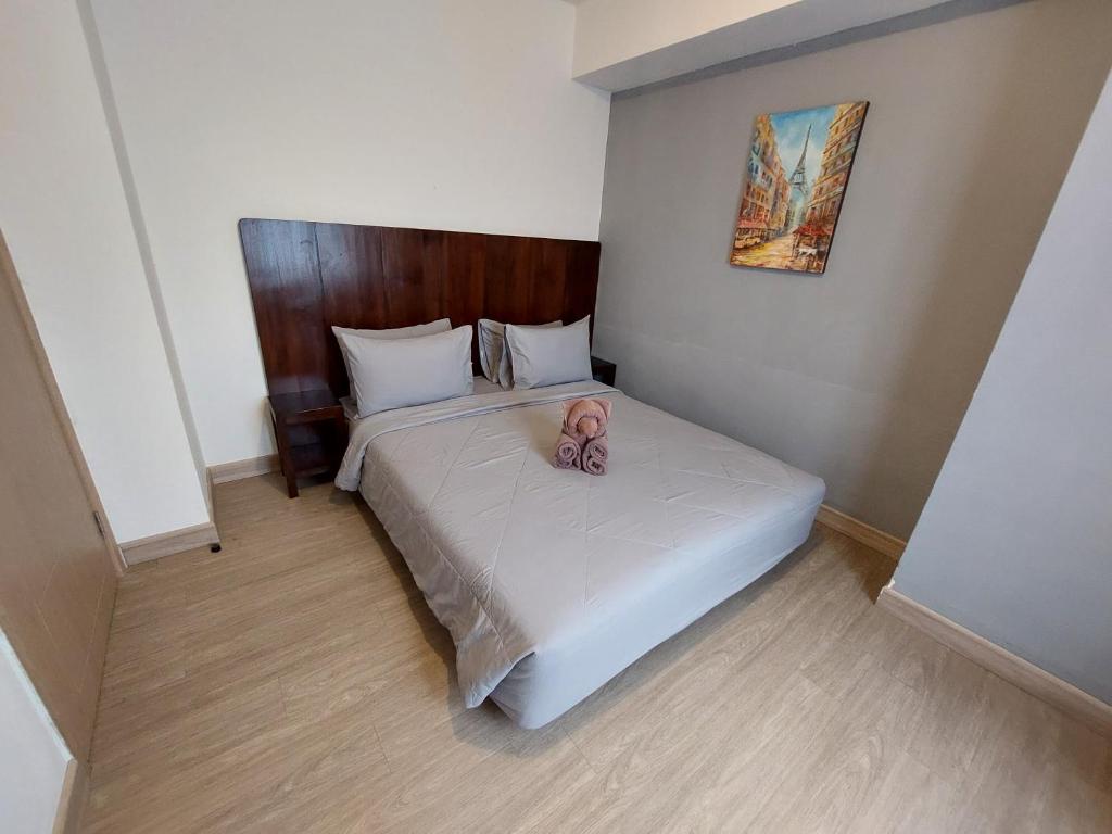 Postel nebo postele na pokoji v ubytování Sienna Residence Bogor