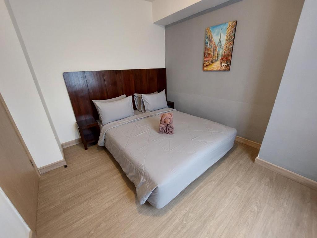 Postel nebo postele na pokoji v ubytování Sienna Residence Bogor