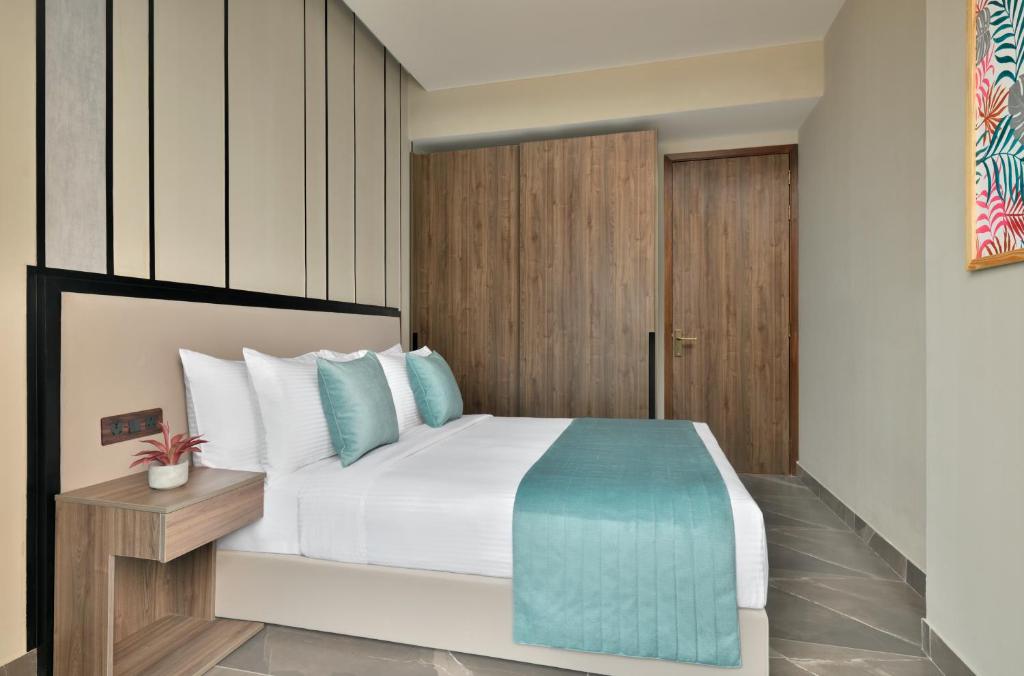 Postel nebo postele na pokoji v ubytování Citadines Paras Square Gurugram