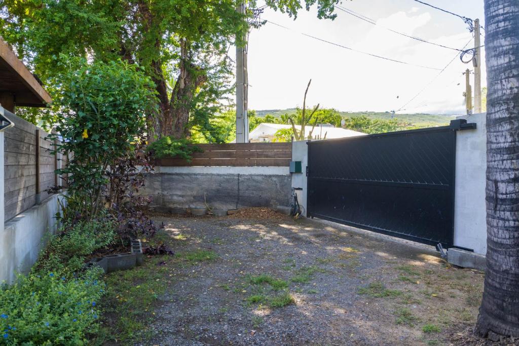 Zahrada ubytování Appart Maïthé 3 Terrasse et proximité lagon