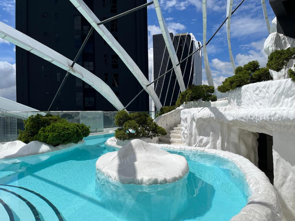a large swimming pool with ice formations in a city at Arte Mont Kiara Free Parking, Kuala Lumpur in Kuala Lumpur