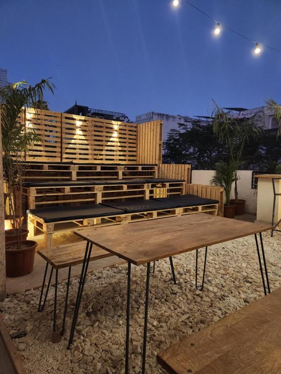 a group of tables and benches on a patio at Bunky in Jaipur