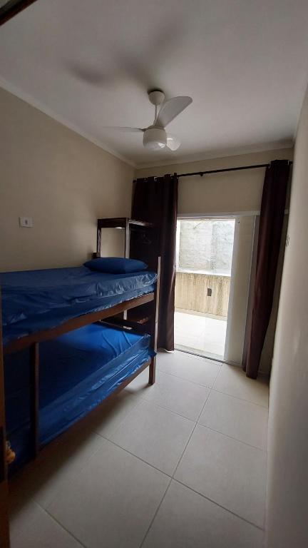 Cama ou camas em um quarto em Casa na Praia do Sapê - Piscina - Churrasqueira